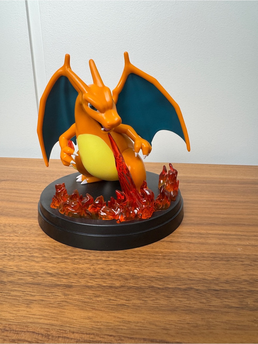 Pokemon Charizard Orange Figure with Teal Wings and Red Flame Base